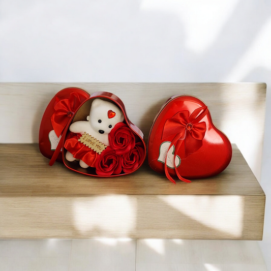 Big heart shape gift with teddy and rose inside
